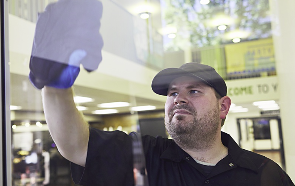 Relay Enterprises Janitor Cleaning Window